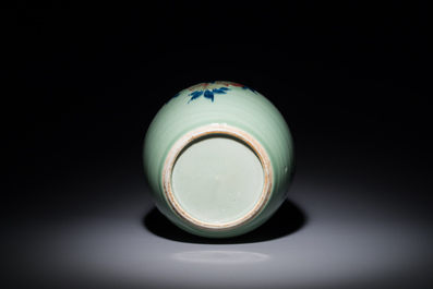 A Chinese celadon-ground blue, white and copper-red ginger jar with reticulated wooden cover and stand, 18th C.