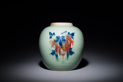 A Chinese celadon-ground blue, white and copper-red ginger jar with reticulated wooden cover and stand, 18th C.
