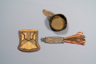 An Iranian gold-thread-embroidered silk caftan, a hat, a coin bracelet and a Koran holder, 19th C.