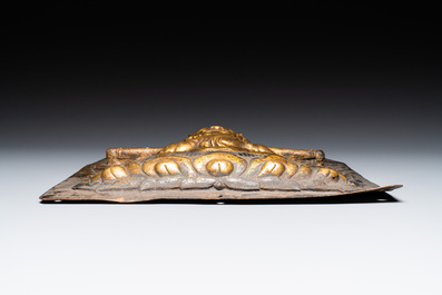 A Tibetan gilt copper 'Mahakala' plaque, 19th C.