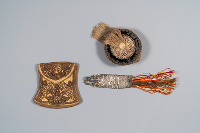 An Iranian gold-thread-embroidered silk caftan, a hat, a coin bracelet and a Koran holder, 19th C.