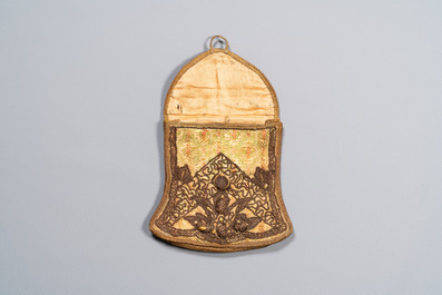 An Iranian gold-thread-embroidered silk caftan, a hat, a coin bracelet and a Koran holder, 19th C.