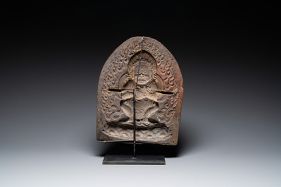 A Tibetan gilt copper 'Mahakala' plaque, 19th C.