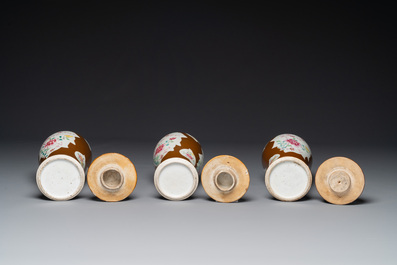 A Chinese capucin-brown-ground famille rose garniture of five vases with floral design, Qianlong