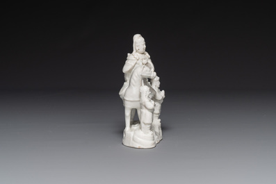A Chinese Dehua blanc de Chine group of Guandi on horseback and two attendants, Kangxi