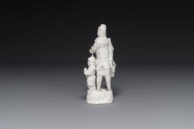A Chinese Dehua blanc de Chine group of Guandi on horseback and two attendants, Kangxi