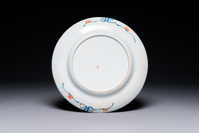 A Dutch Delft Imari-style dish with antiquities, 'AK' mark, 18th C.