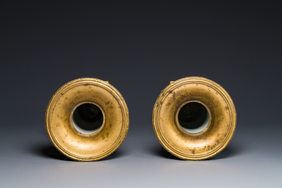 A pair of Chinese gilt-decorated powder-blue 'yenyen' vases with gilt bronze mounts, Kangxi