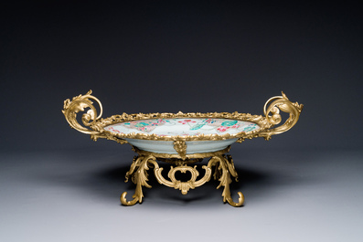 A Chinese famille rose 'flower basket' dish with gilt bronze mount, Yongzheng