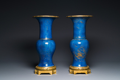 A pair of Chinese gilt-decorated powder-blue 'yenyen' vases with gilt bronze mounts, Kangxi