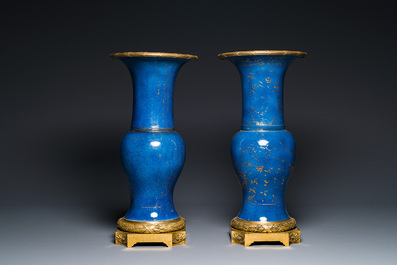 A pair of Chinese gilt-decorated powder-blue 'yenyen' vases with gilt bronze mounts, Kangxi