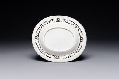 An oval Chinese Canton famille rose dish with a reticulated border, 19th C.