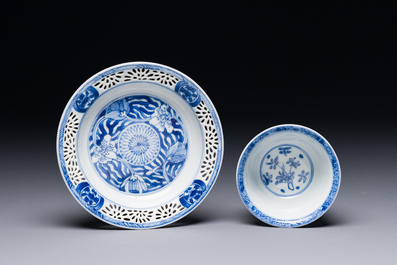 A Chinese blue and white reticulated double-walled cup and saucer, Kangxi