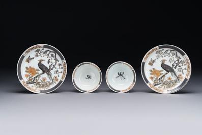 A pair of Chinese grisaille and gilt 'pheasant' cups and saucers, Yongzheng