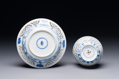 A Chinese blue and white reticulated double-walled cup and saucer, Kangxi