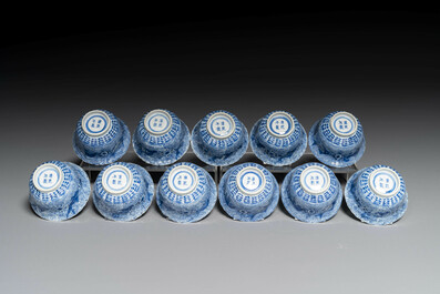 Eleven Chinese blue and white 'crab and fish' cups and saucers, Kangxi mark, Guangxu