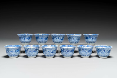 Eleven Chinese blue and white 'crab and fish' cups and saucers, Kangxi mark, Guangxu