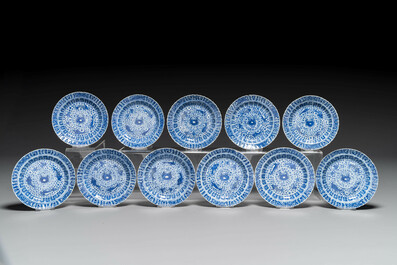 Eleven Chinese blue and white 'crab and fish' cups and saucers, Kangxi mark, Guangxu