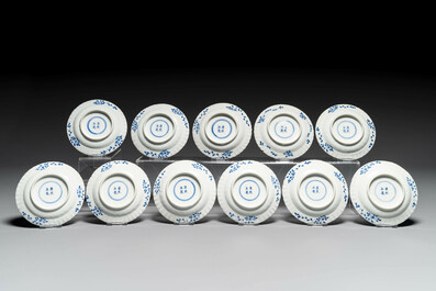 Eleven Chinese blue and white 'crab and fish' cups and saucers, Kangxi mark, Guangxu