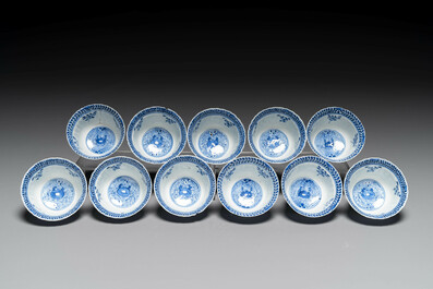 Eleven Chinese blue and white 'crab and fish' cups and saucers, Kangxi mark, Guangxu