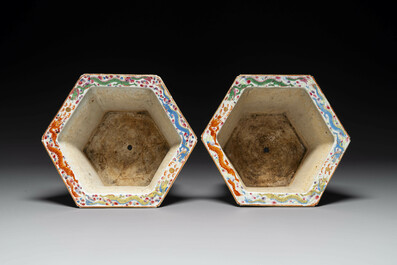 A pair of hexagonal Chinese Canton famille rose jardinieres on stands, 19th C.