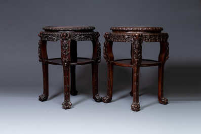 A pair of large Chinese carved wooden stands with marble tops, 19th C.