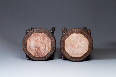 A pair of large Chinese carved wooden stands with marble tops, 19th C.