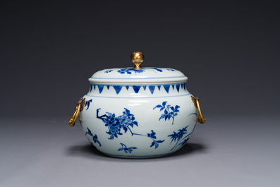 A Chinese blue and white covered bowl with floral design and gilt bronze mounts, Transitional period