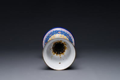 A large Chinese Canton enamel blue-ground 'shou' candlestick, Qianlong/Jiaqing