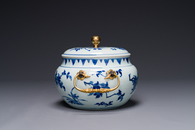 A Chinese blue and white covered bowl with floral design and gilt bronze mounts, Transitional period