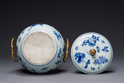 A Chinese blue and white covered bowl with floral design and gilt bronze mounts, Transitional period