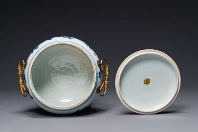 A Chinese blue and white covered bowl with floral design and gilt bronze mounts, Transitional period