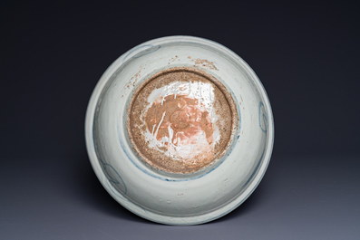 A large Chinese blue and white Swatow dish with a lobster and a carp at a fishing village, Ming