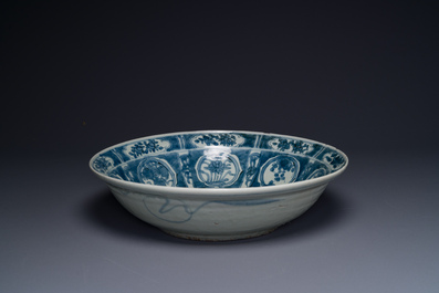 A large Chinese blue and white Swatow dish with a lobster and a carp at a fishing village, Ming