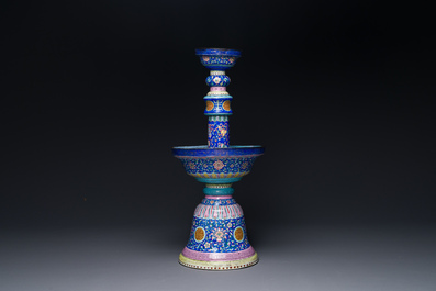 A large Chinese Canton enamel blue-ground 'shou' candlestick, Qianlong/Jiaqing
