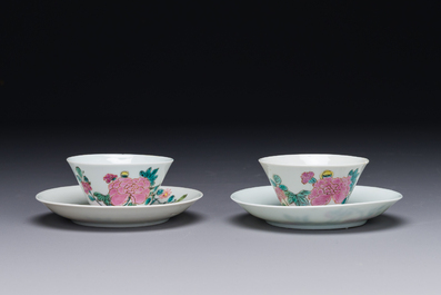 A pair of Chinese famille rose 'peony' cups and saucers, Yongzheng