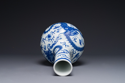 A Chinese blue and white 'dragon' bottle vase, Yongzheng mark, 19th C.