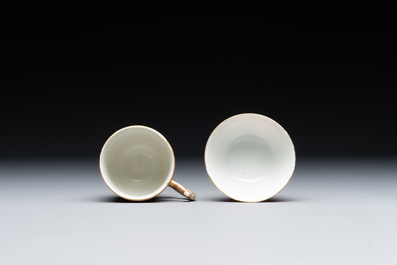 Two rare Chinese iron-red-decorated 'European scene' cups and a saucer, Qianlong