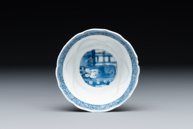 Four Chinese blue and white saucers and an 'erotic' cup, Kangxi
