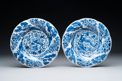 Four Chinese blue and white lobed 'phoenix and monkey' plates, flower mark, Kangxi