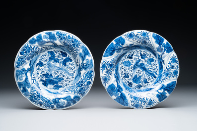 Four Chinese blue and white lobed 'phoenix and monkey' plates, flower mark, Kangxi