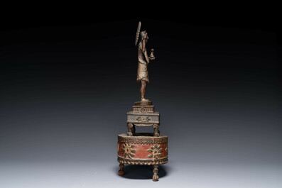 An Indo-Portuguese wooden sculpture of John the Baptist with a lamb, dated 1704