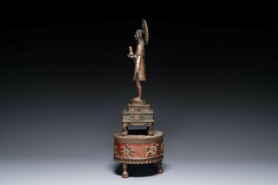 An Indo-Portuguese wooden sculpture of John the Baptist with a lamb, dated 1704