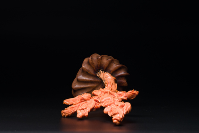 A Chinese red coral figure of Xiwangmu on wooden stand, 19/20th C.