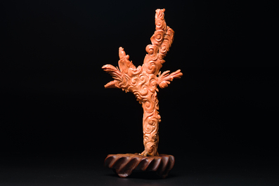 A Chinese red coral figure of Xiwangmu on wooden stand, 19/20th C.