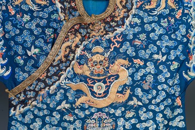 A Chinese gold thread embroidered blue-ground silk 'dragon' robe, 19th C.