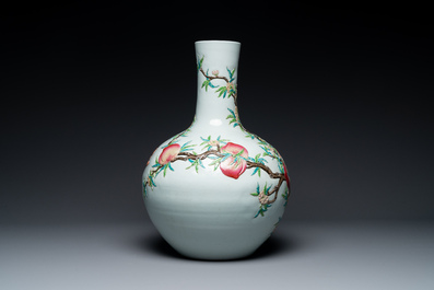 A Chinese famille rose relief-molded 'tianqiuping' vase with nine peaches, Qianlong mark, 19/20th C.