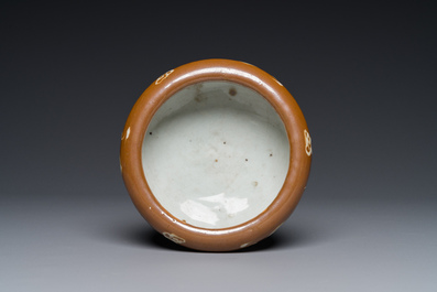 A rare Chinese Swatow slip-decorated brown-glazed tripod censer with cranes, Ming