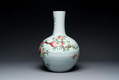 A Chinese famille rose relief-molded 'tianqiuping' vase with nine peaches, Qianlong mark, 19/20th C.