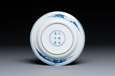 A Chinese blue and white plate with a breastfeeding woman and fishermen on boats, Chenghua mark, Kangxi